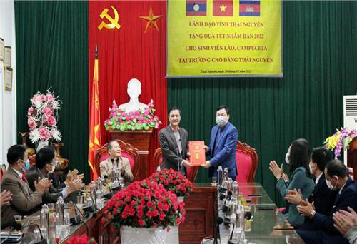 Presenting gifts for Lao and Cambodian students 