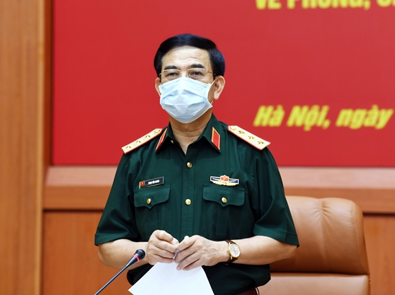  Thượng tướng Phan Văn Giang giao nhiệm vụ cho Học viện Quân y chiều 16-5. Ảnh TRỌNG HẢI.